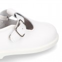 Little Washable leather T-strap shoes with buckle fastening.