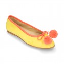 Soft suede leather classic ballet flats with pompons.