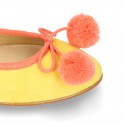Soft suede leather classic ballet flats with pompons.