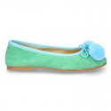 Soft suede leather classic ballet flats with pompons.