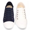 Cotton Canvas BAMBA type shoes with ties closure and toe cap.