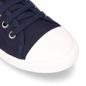 Cotton Canvas BAMBA type shoes with ties closure and toe cap.