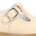 Classic Nappa Leather pepitos or T-strap shoes with buckle fastening.