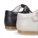 Classic Nappa Leather pepitos or T-strap shoes with buckle fastening.