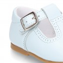 Classic Nappa Leather pepitos or T-strap shoes with buckle fastening.