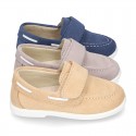 Suede leather Boat shoes with velcro strap.