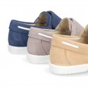 Suede leather Boat shoes with velcro strap.