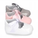 Patent leather Little Mary Janes angel style with waves and ties.