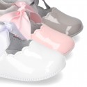 Patent leather Little Mary Janes angel style with waves and ties.