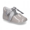 Patent leather Little Mary Janes angel style with waves and ties.