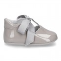Patent leather Little Mary Janes angel style with waves and ties.