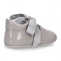 Patent leather Little Mary Janes angel style with waves and ties.