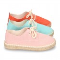 Laces up espadrille shoes in washing effect cotton canvas.