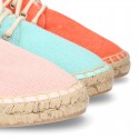 Laces up espadrille shoes in washing effect cotton canvas.