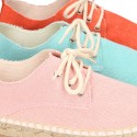 Laces up espadrille shoes in washing effect cotton canvas.