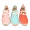 Laces up espadrille shoes in washing effect cotton canvas.