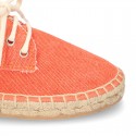 Laces up espadrille shoes in washing effect cotton canvas.