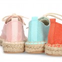 Laces up espadrille shoes in washing effect cotton canvas.