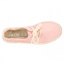Laces up espadrille shoes in washing effect cotton canvas.