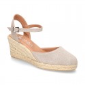 Wedge women canvas sandal espadrille with buckle fastening in washing effect.