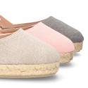 Wedge women canvas sandal espadrille with buckle fastening in washing effect.