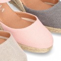 Wedge women canvas sandal espadrille with buckle fastening in washing effect.