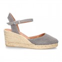 Wedge women canvas sandal espadrille with buckle fastening in washing effect.