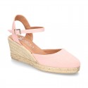 Wedge women canvas sandal espadrille with buckle fastening in washing effect.