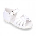 New patent leather sandals with ribbon and super flexible soles for little girls.