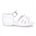 New patent leather sandals with ribbon and super flexible soles for little girls.