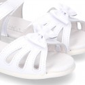 New patent leather sandals with ribbon and super flexible soles for little girls.