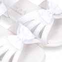 New patent leather sandals with ribbon and super flexible soles for little girls.