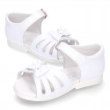 New patent leather sandals with ribbon and super flexible soles for little girls.