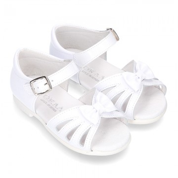 New patent leather sandals with ribbon and super flexible soles for little girls.