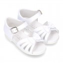 New patent leather sandals with ribbon and super flexible soles for little girls.