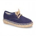 Laces up espadrille shoes in washing effect cotton canvas.