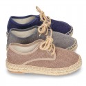 Laces up espadrille shoes in washing effect cotton canvas.