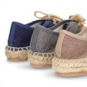 Laces up espadrille shoes in washing effect cotton canvas.