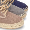 Laces up espadrille shoes in washing effect cotton canvas.