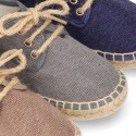 Laces up espadrille shoes in washing effect cotton canvas.