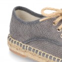 Laces up espadrille shoes in washing effect cotton canvas.