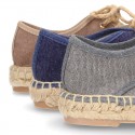 Laces up espadrille shoes in washing effect cotton canvas.