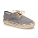 Laces up espadrille shoes in washing effect cotton canvas.