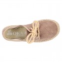 Laces up espadrille shoes in washing effect cotton canvas.