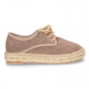 Laces up espadrille shoes in washing effect cotton canvas.