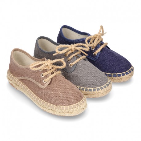 Laces up espadrille shoes in washing effect cotton canvas.