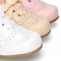 Classic soft nappa leather Laces up shoes in pastel colors.