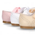 Classic soft nappa leather Laces up shoes in pastel colors.