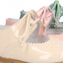 Little Mary jane shoes angel style in patent leather in pastel colors.