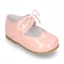 Little Mary jane shoes angel style in patent leather in pastel colors.